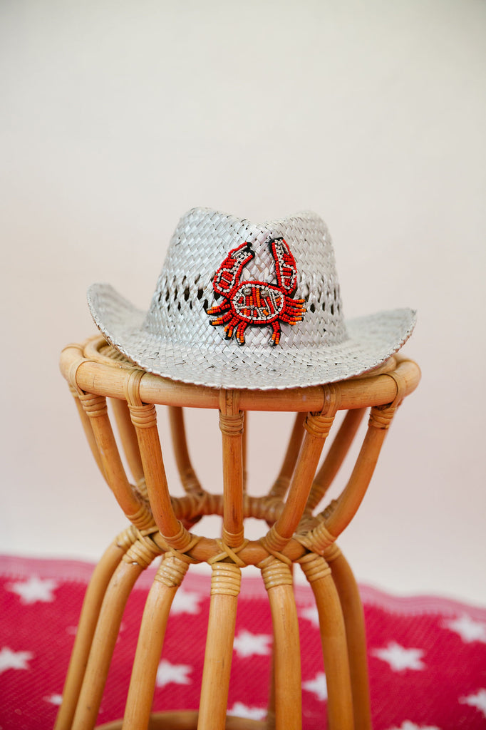 Kids silver straw hat with a red beaded crab patch