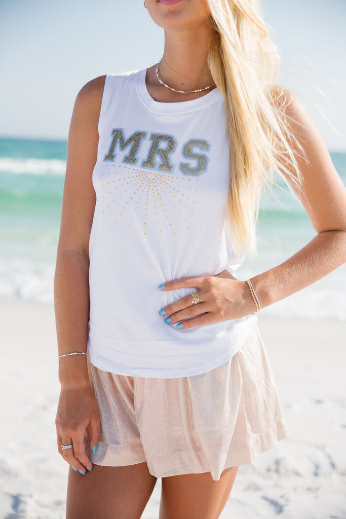 White tank top with gold "Mrs" text across the front with gold rhinestones. 