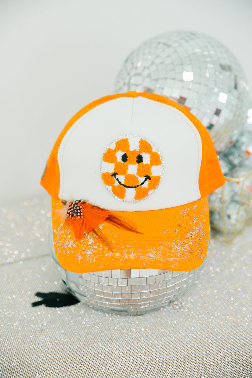 ORANGE CHECKERED SMILEY TRUCKER HAT TRUCKER HAT Judith March
