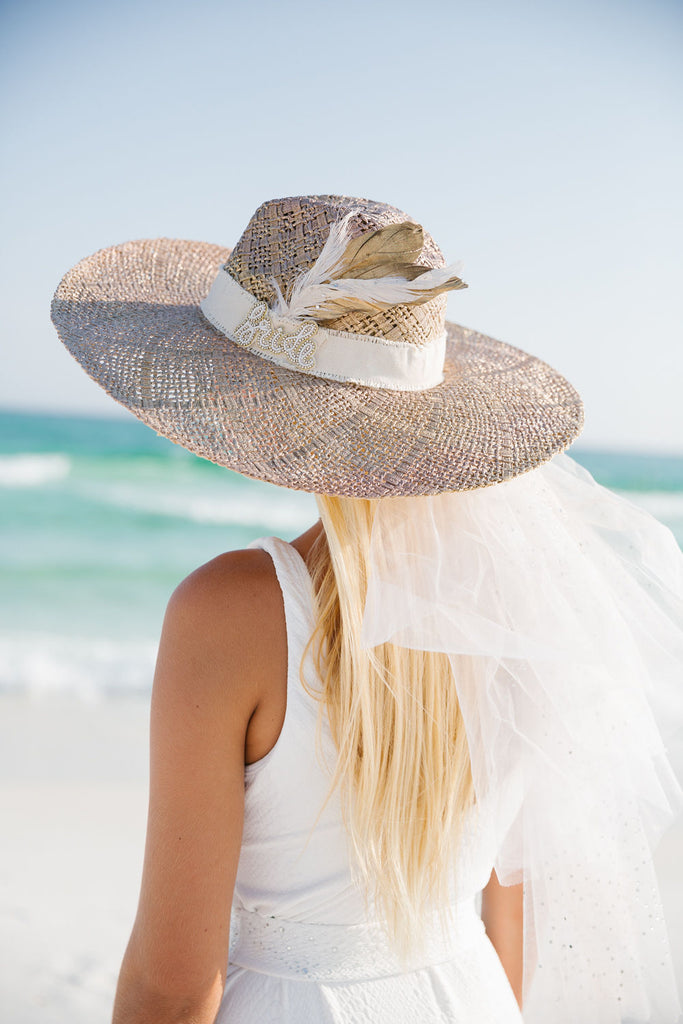 Bride sun hat with feathers and veil. 