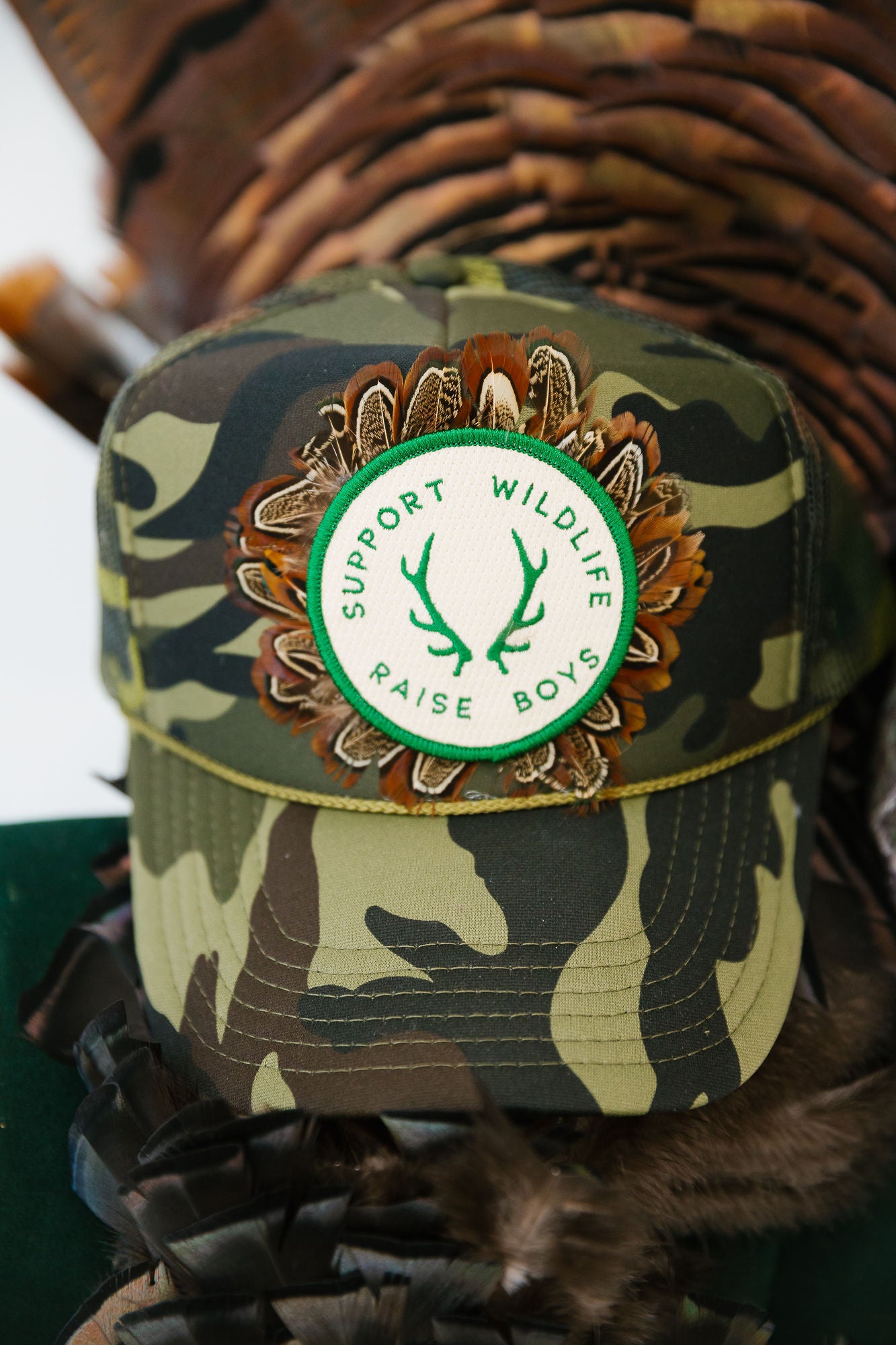 SUPPORT WILDLIFE RAISE BOYS CAMO TRUCKER HAT TRUCKER HAT Judith March