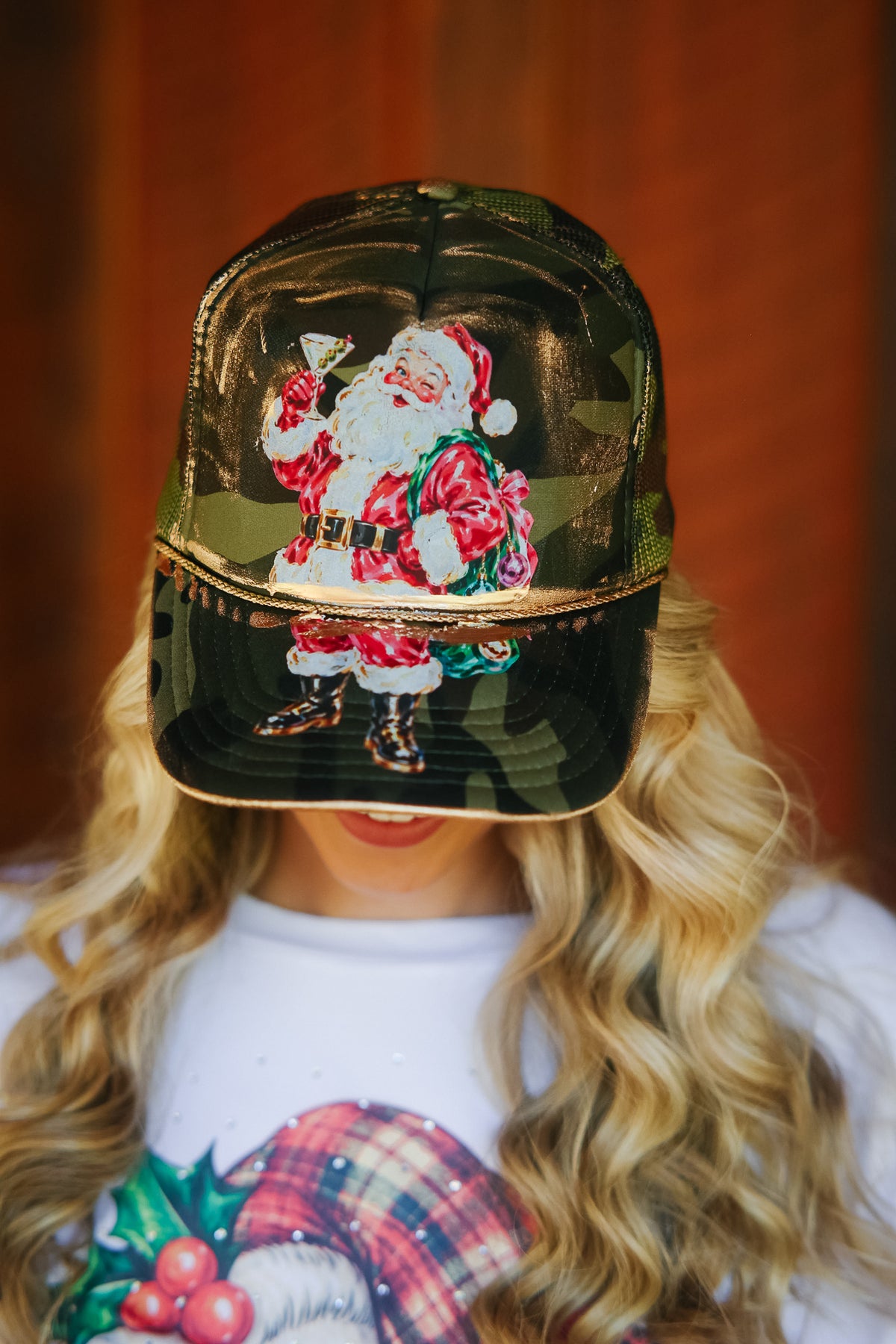 SANTA CLAUS SIPS CAMO TRUCKER HAT TRUCKER HAT Judith March