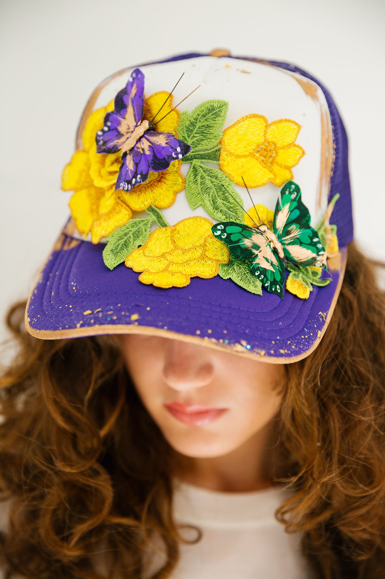 CARNIVAL WINGS PURPLE TRUCKER HAT TRUCKER HAT Judith March