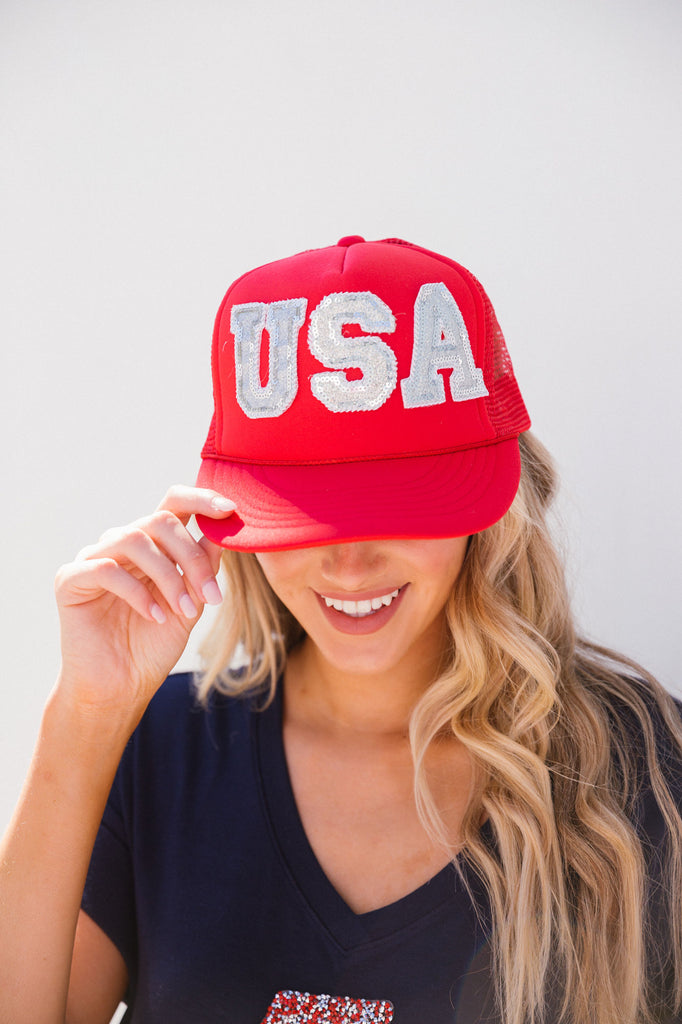 Red trucker hat with silver sparkle "USA" letters