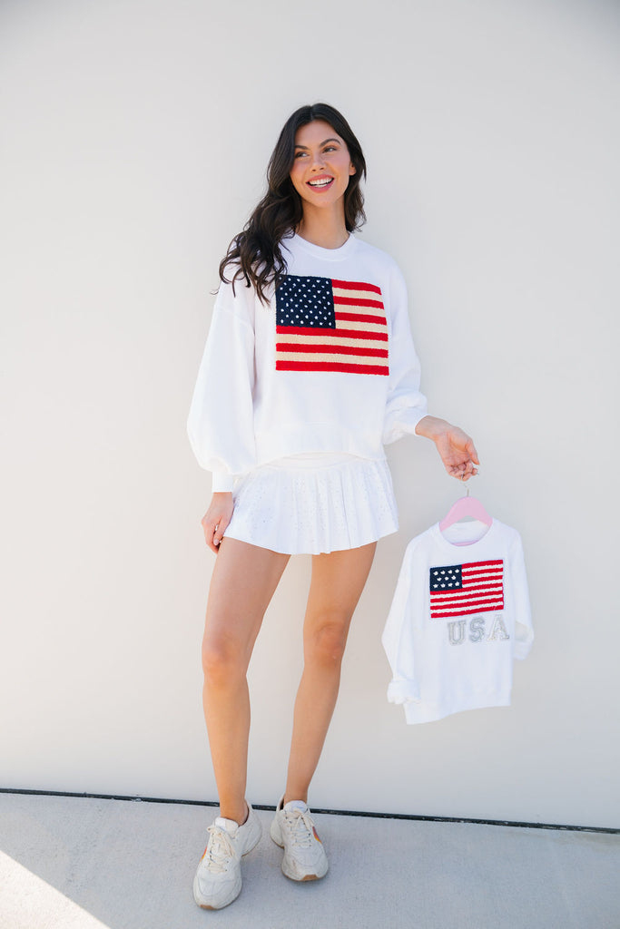 Kids white pullover with an American Flag and silver sparkle "USA" letters