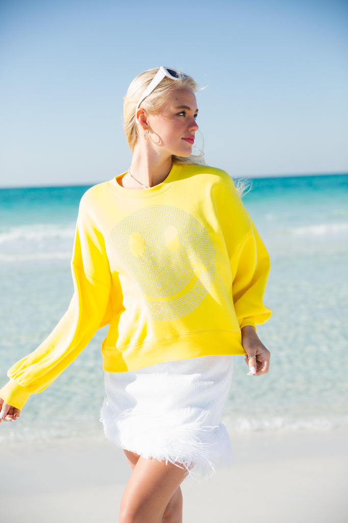 Yellow cropped pullover with silver smiley face