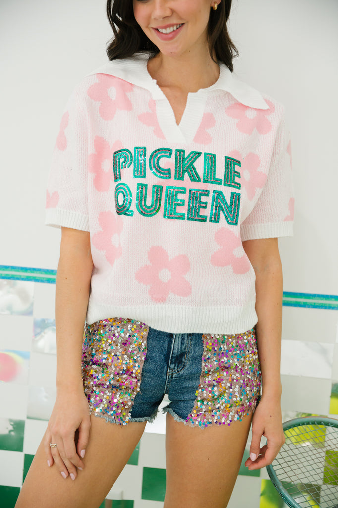 Pink and white floral top with "pickle queen" in green sequin lettering. 