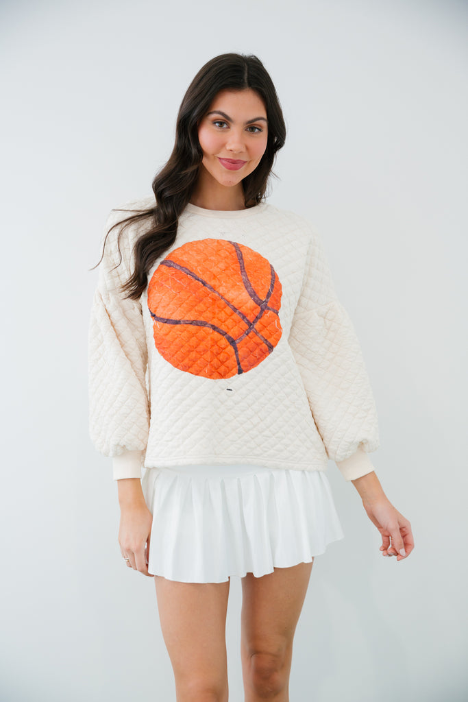 Cream quilted pullover with basketball print