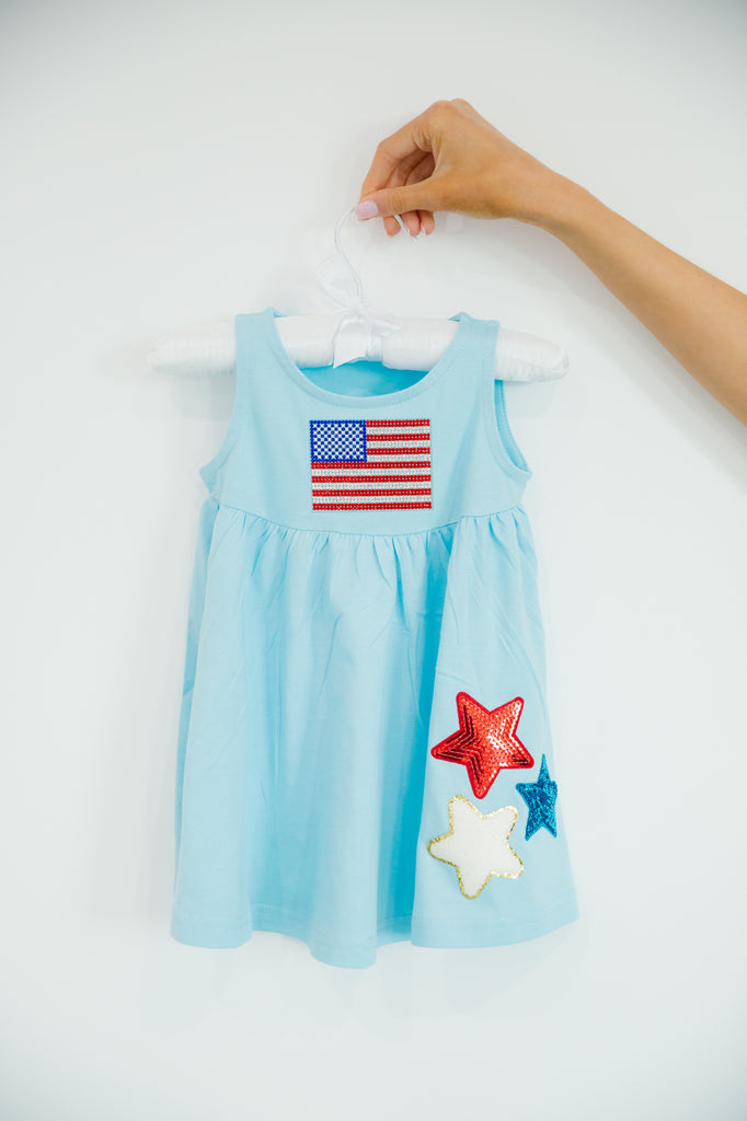 Kids blue dress with an American flag and star patches