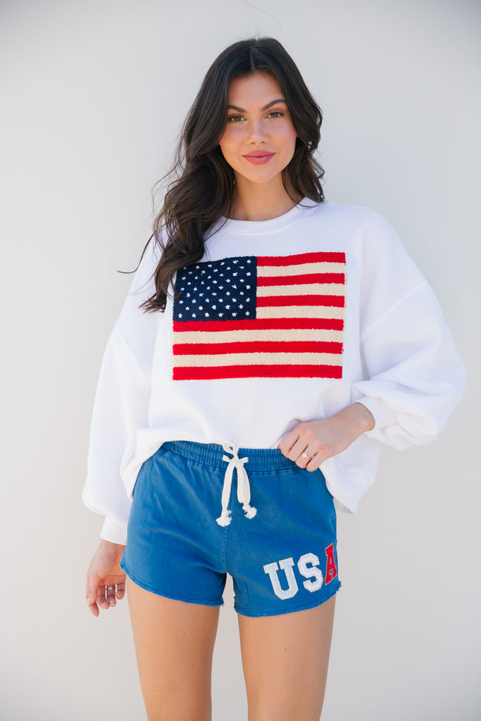 Blue shorts with red, white, and blue "USA" letters
