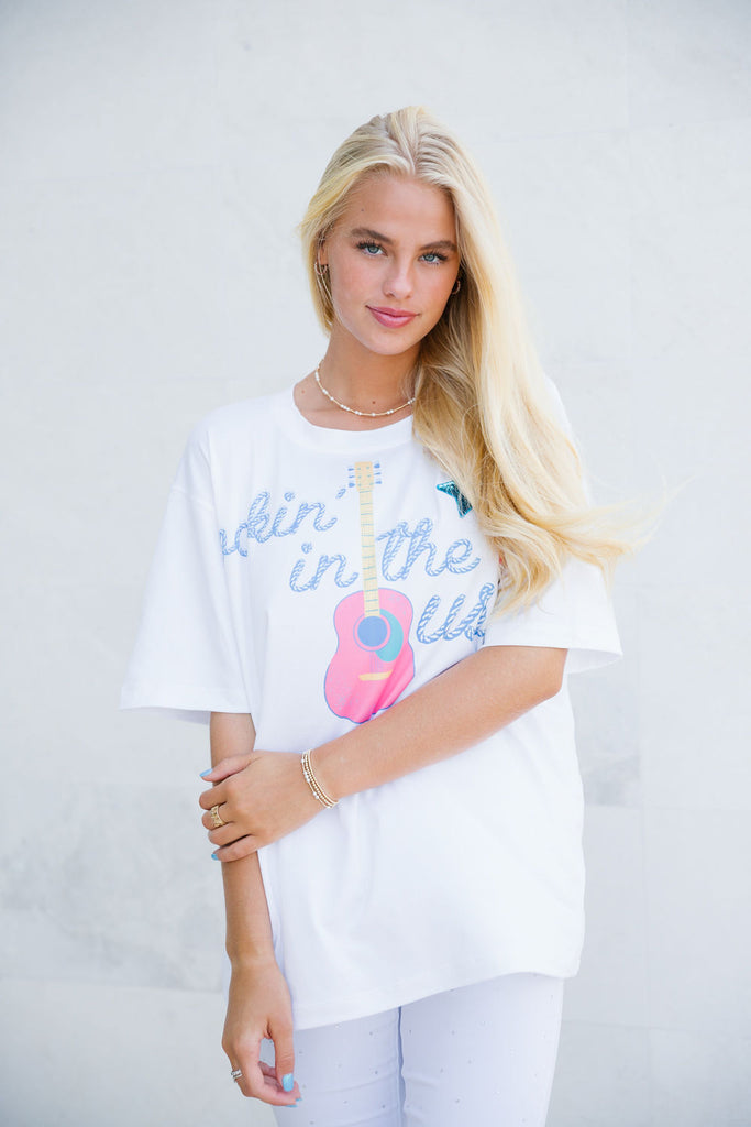 White tee with Rockin' In The USA guitar print and sequin star patches.