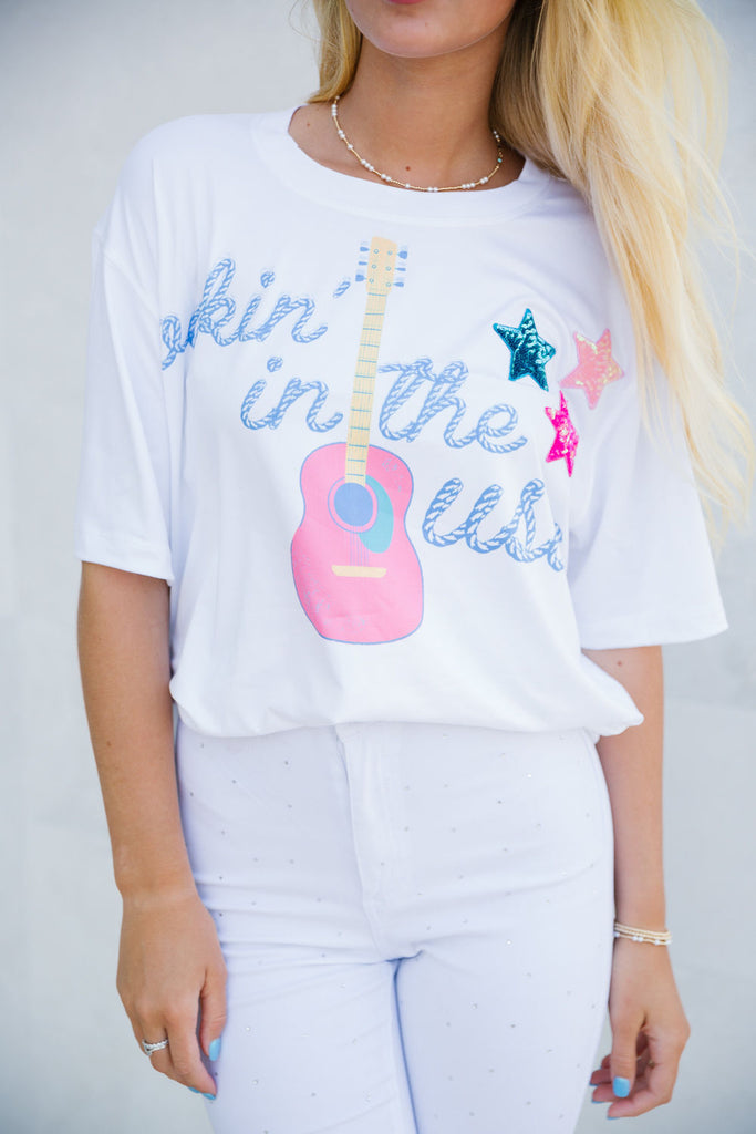 White tee with Rockin' In The USA guitar print and sequin star patches.