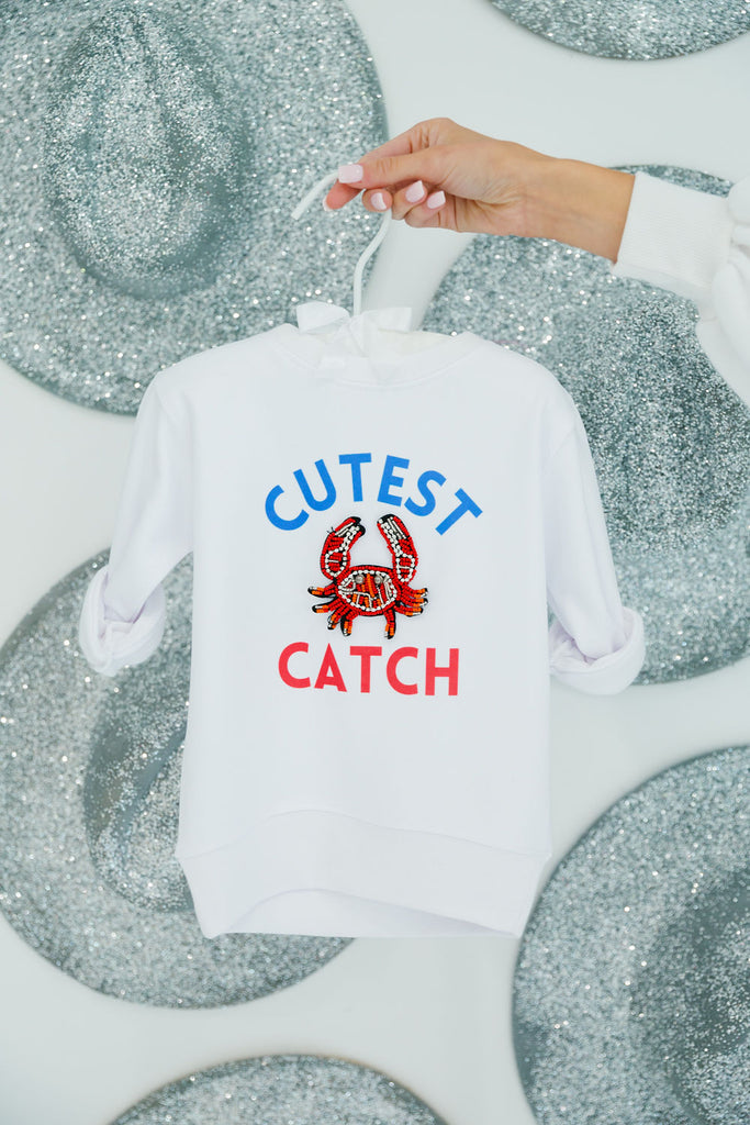 Kids white pullover with a red beaded crab patch and "Cutest Catch" print 