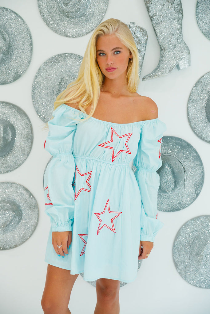 Blue long-sleeve dress with red outlined stars