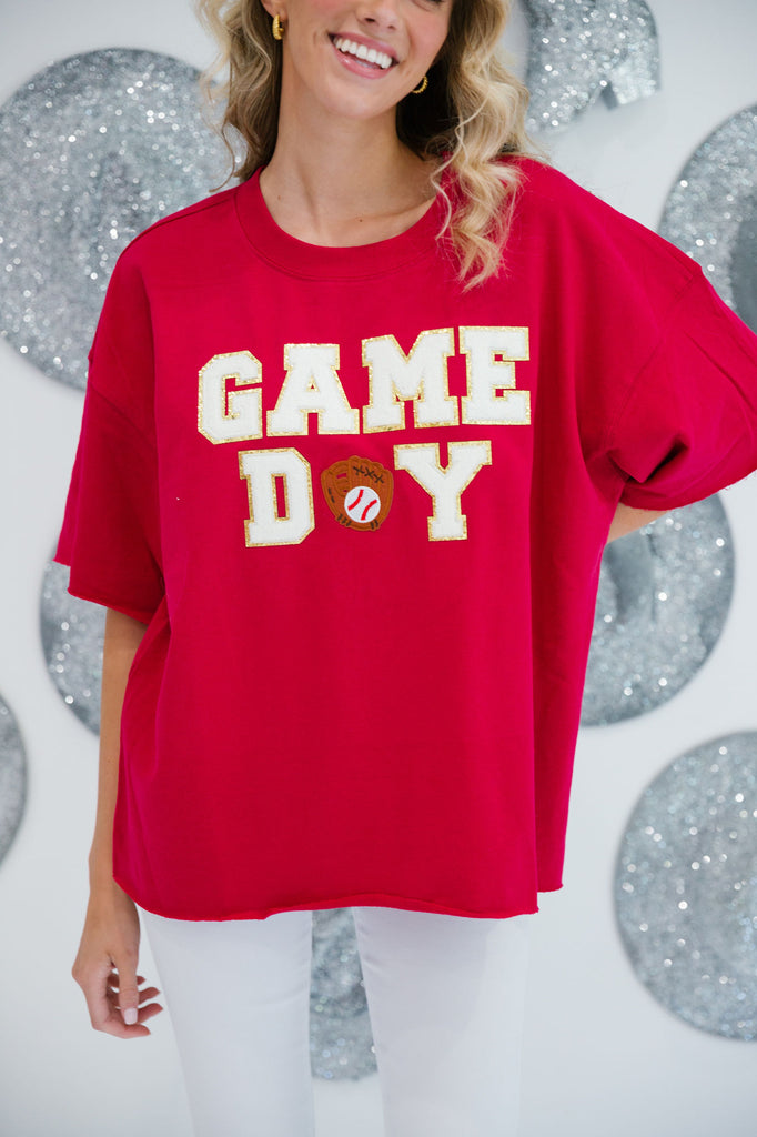 Red t-shirt with "Game Day" in white letters and a baseball mitt patch as the A in "Day"