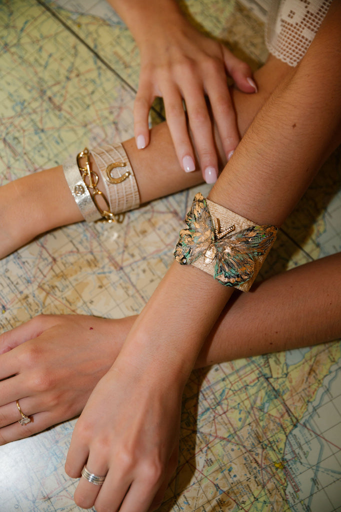 Gold band bracelet with butterfly