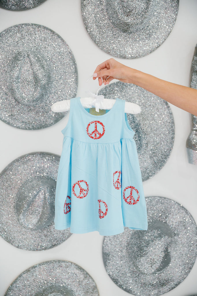 Kids blue dress with red peace signs