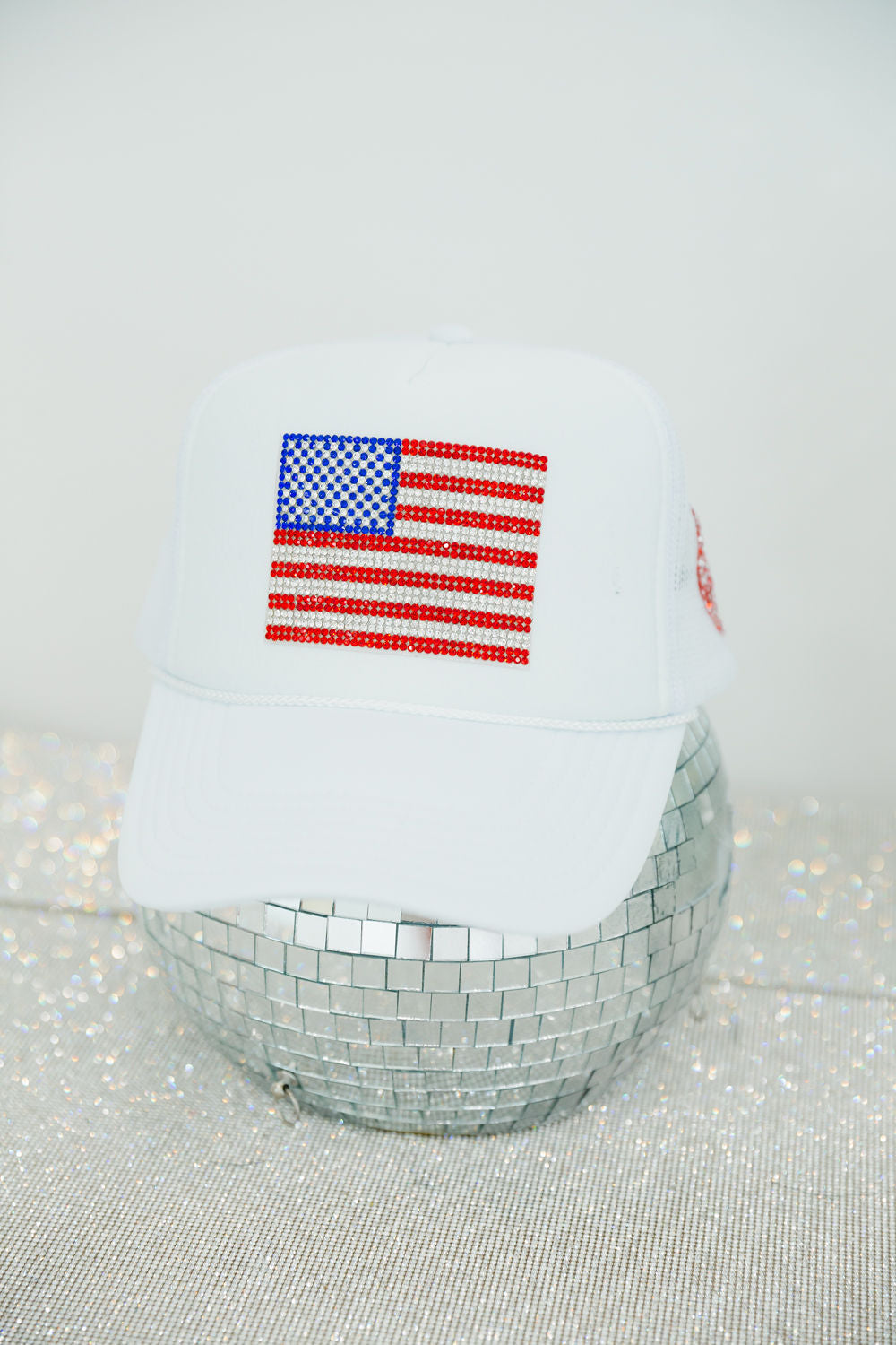 RHINESTONE FLAG WHITE TRUCKER HAT TRUCKER HAT Judith March