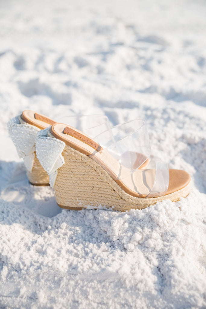 Clear wedges with white beaded bows. 