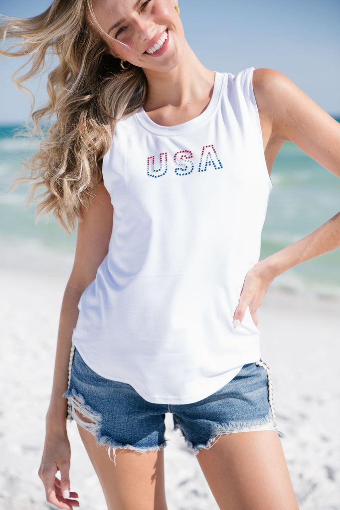 White tank top with red, white, and blue rhinestoned "USA"