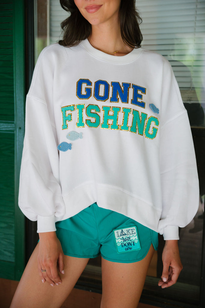 White cropped pullover with Gone Fishing in royal blue and turquoise terry letters and fish patches