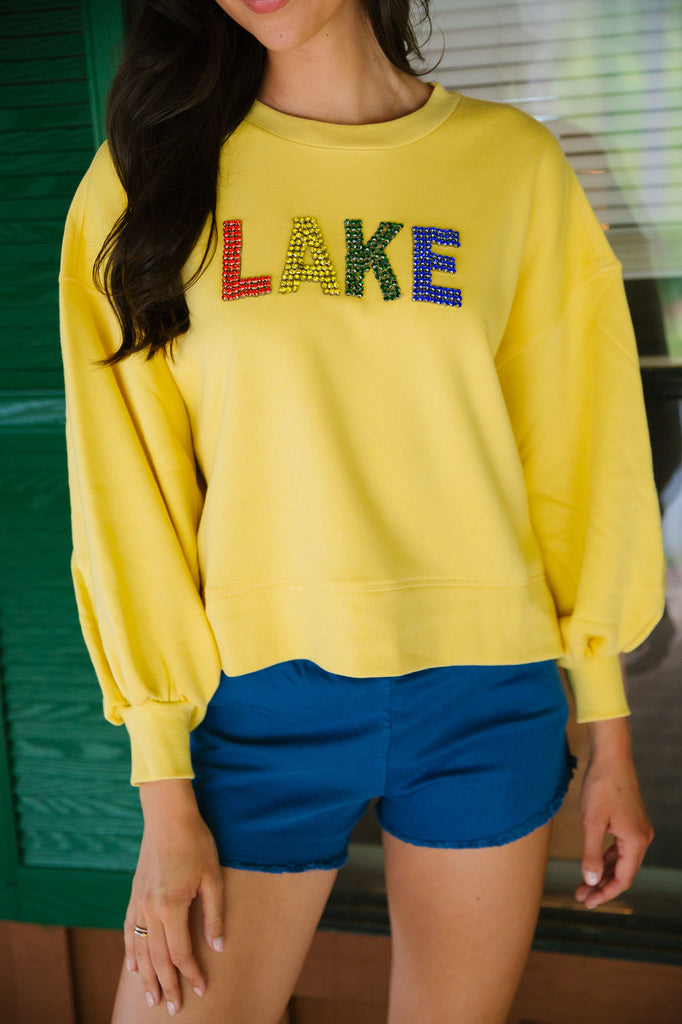 Yellow cropped pullover with Lake in rainbow diamond lettering
