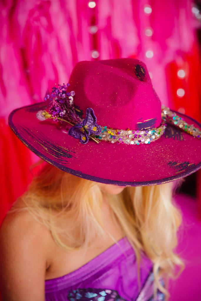 Hot pink rancher with purple accents and a colorful sequin band with a butterfly