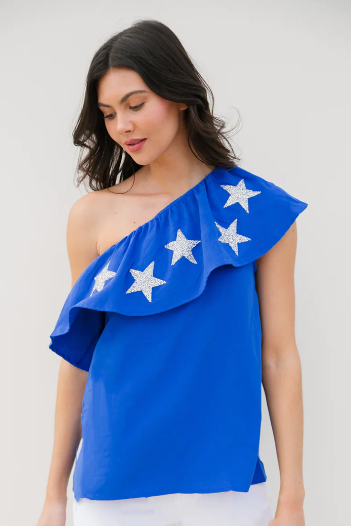 Blue one-shoulder top with silver stars