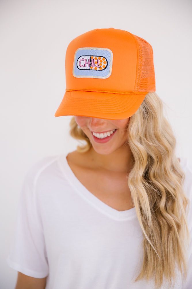 CHILL PILL ORANGE TRUCKER HAT Judith March