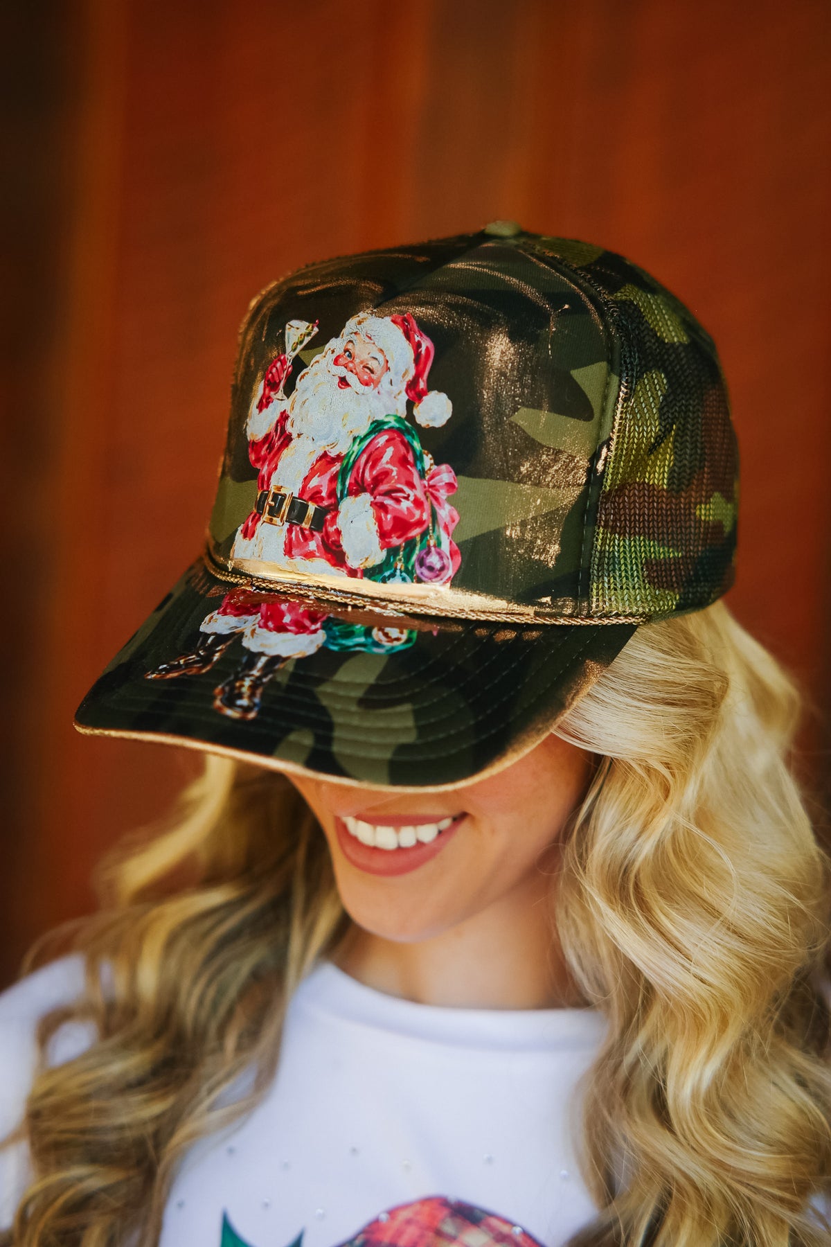 SANTA CLAUS SIPS CAMO TRUCKER HAT TRUCKER HAT Judith March