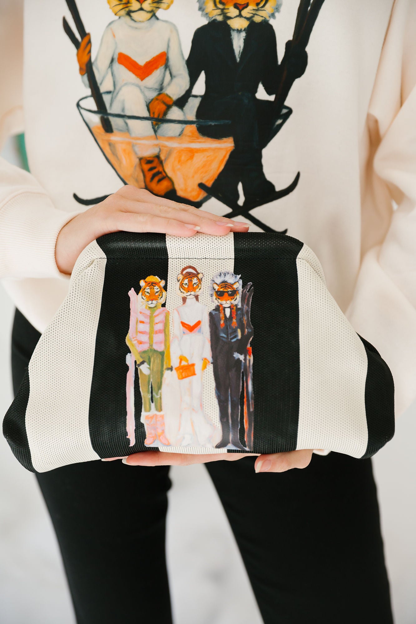 PROWL & POWDER STRIPED CLUTCH Clutch Judith March