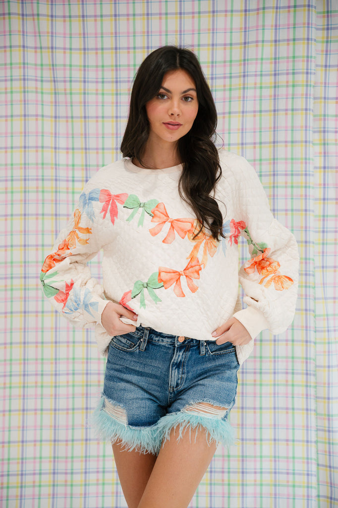 BOW PRINT QUILTED PULLOVER