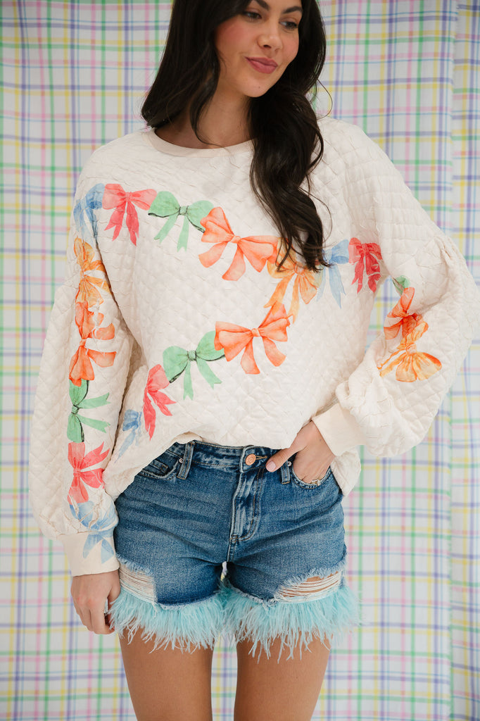 BOW PRINT QUILTED PULLOVER