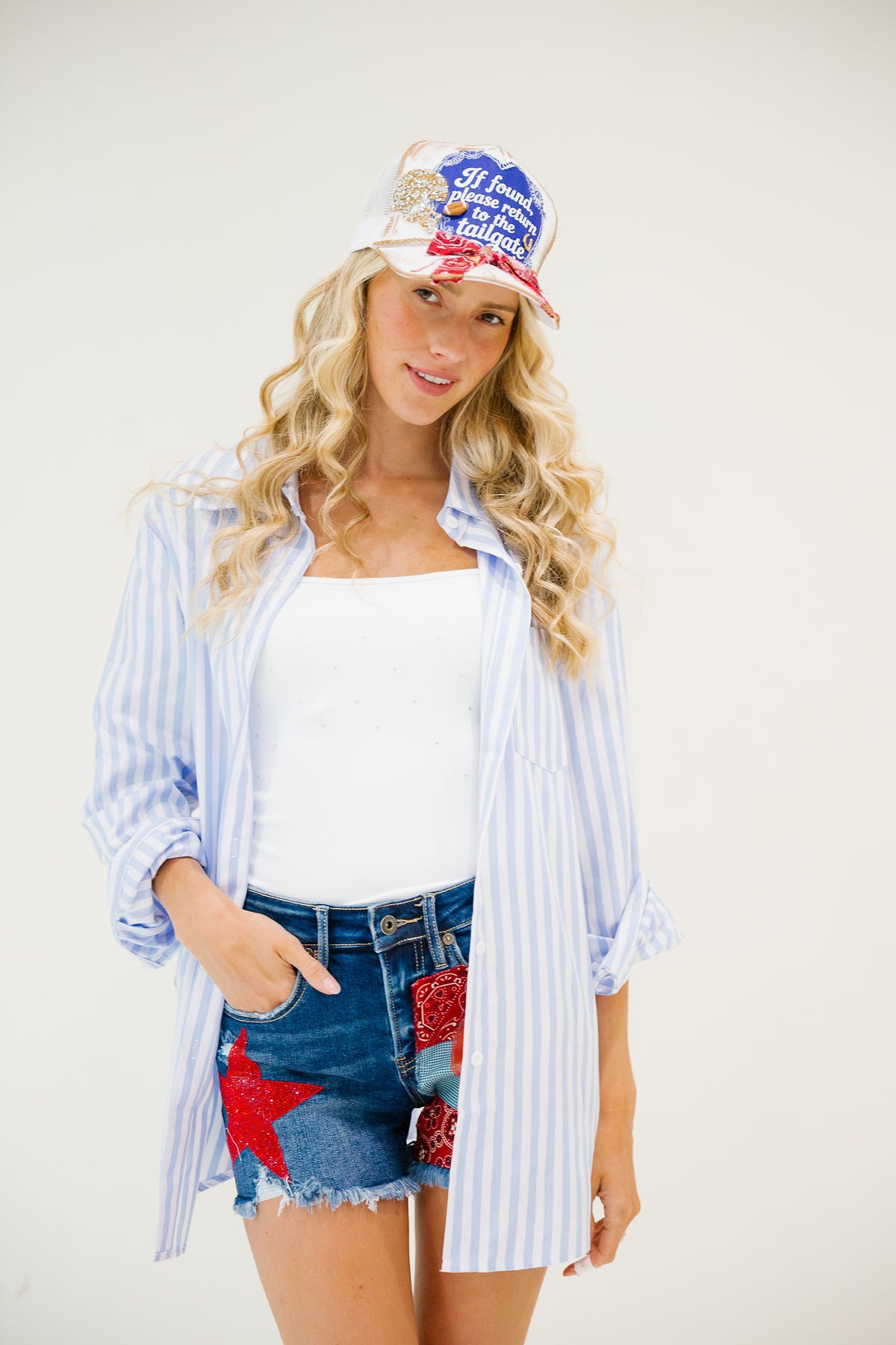 IF FOUND, PLEASE RETURN TO TAILGATE BLUE BUTTON DOWN