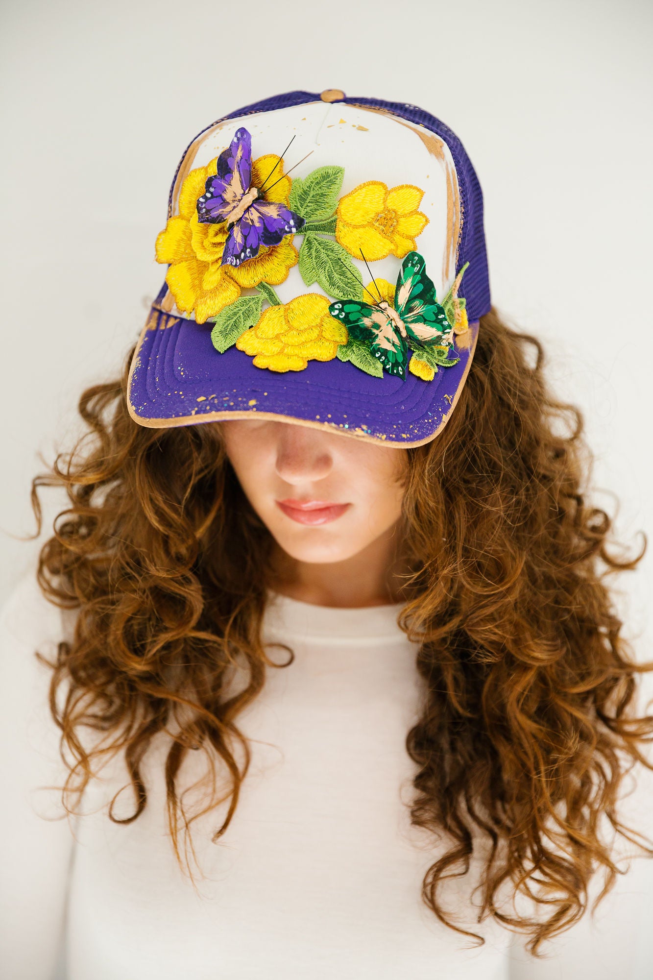 CARNIVAL WINGS PURPLE TRUCKER HAT TRUCKER HAT Judith March