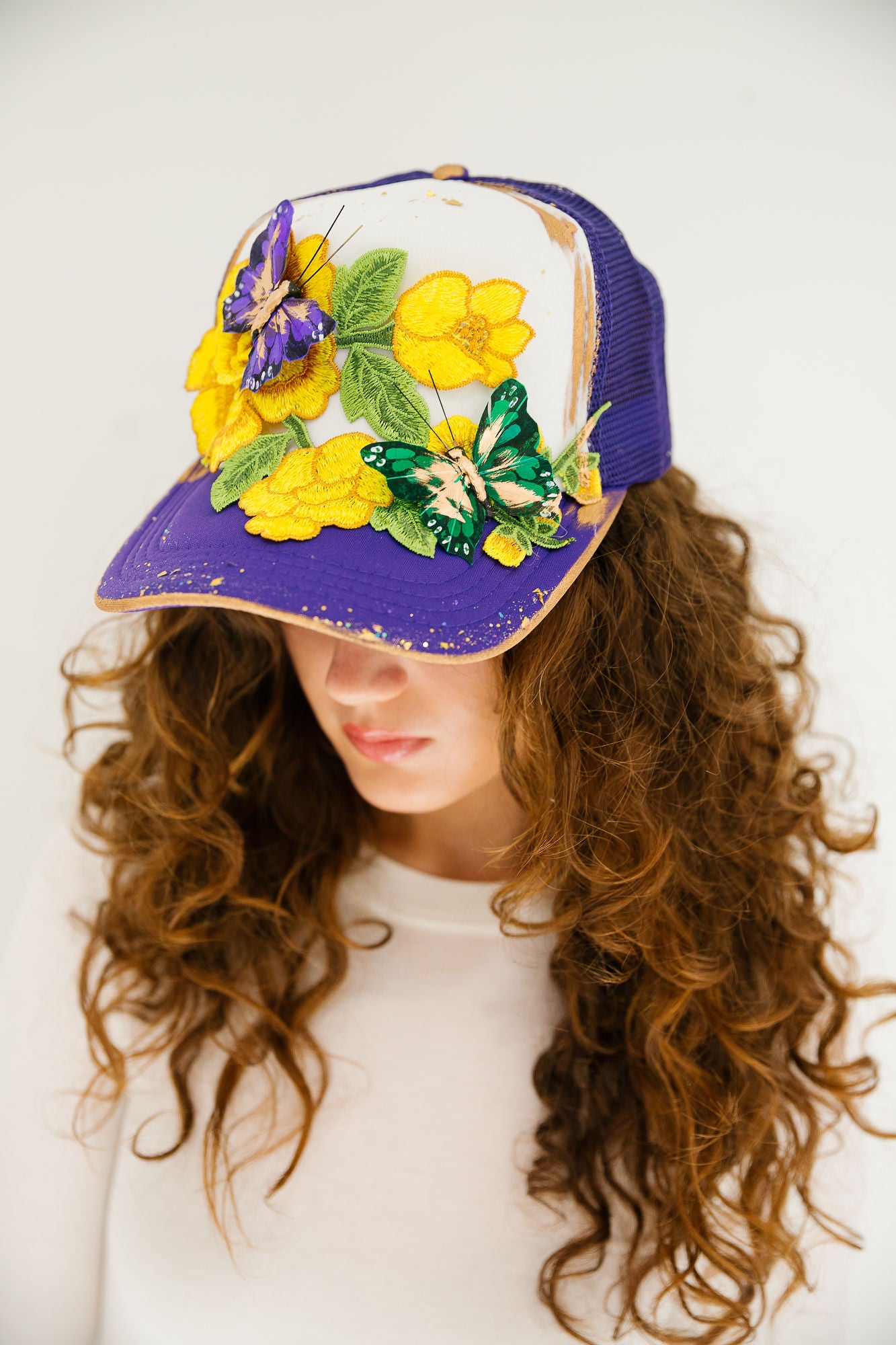 CARNIVAL WINGS PURPLE TRUCKER HAT TRUCKER HAT Judith March