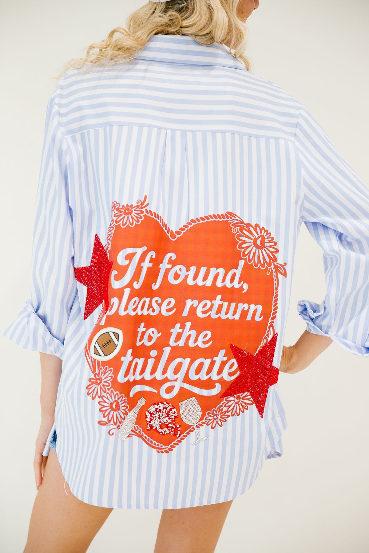 IF FOUND, PLEASE RETURN TO TAILGATE BLUE BUTTON DOWN