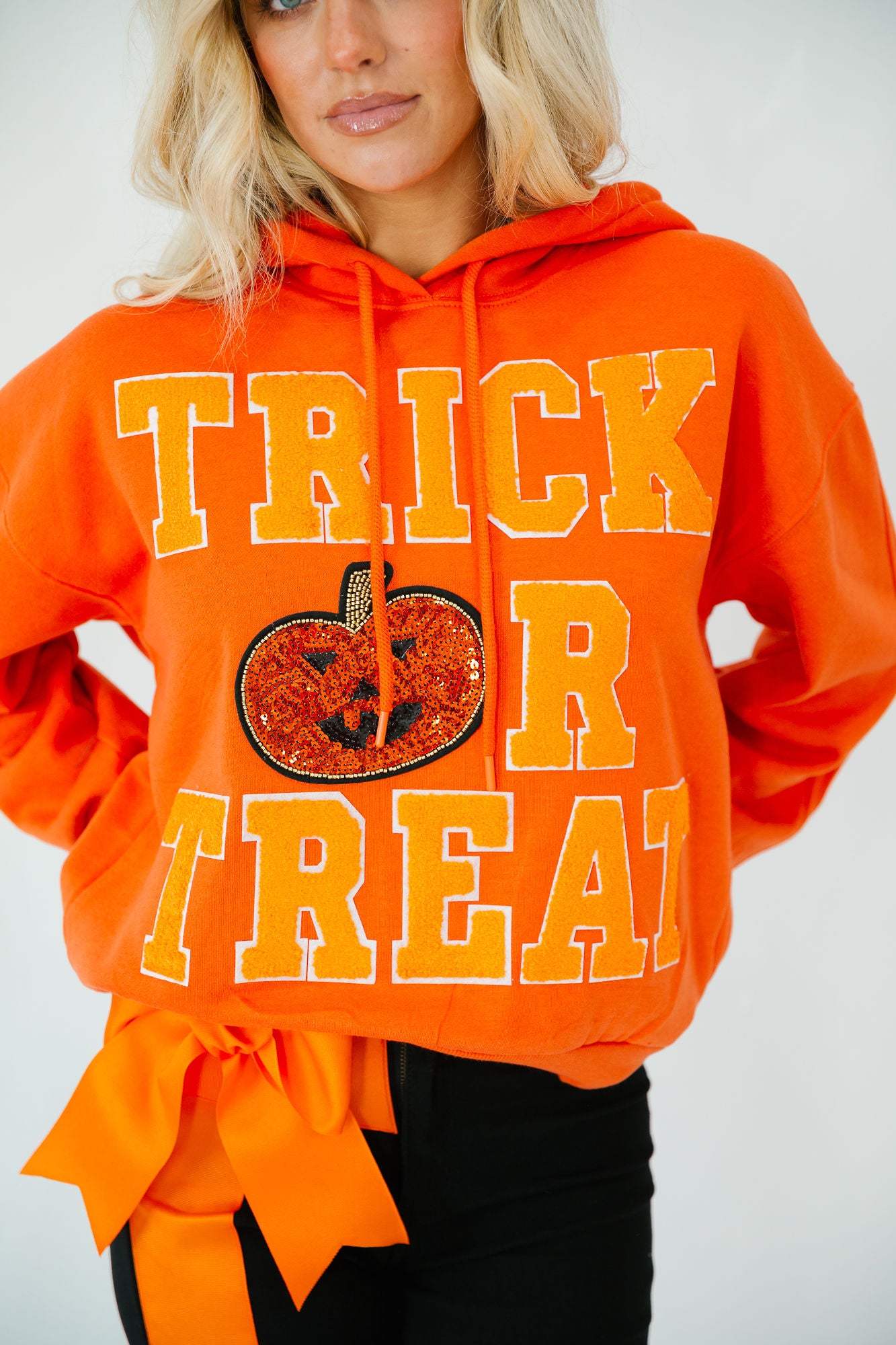 TRICK OR TREAT ORANGE VARSITY HOODIE HOODIE Judith March