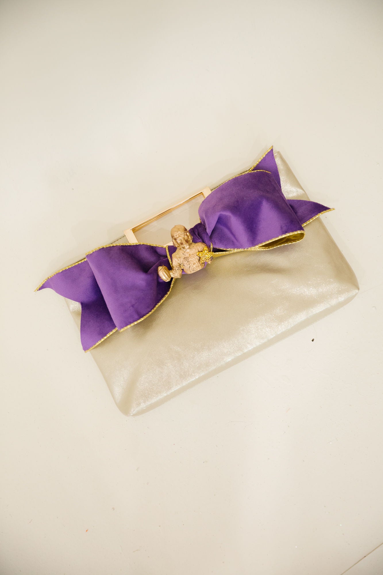 GOLDEN MVP BOW CLUTCH PURSE Judith March