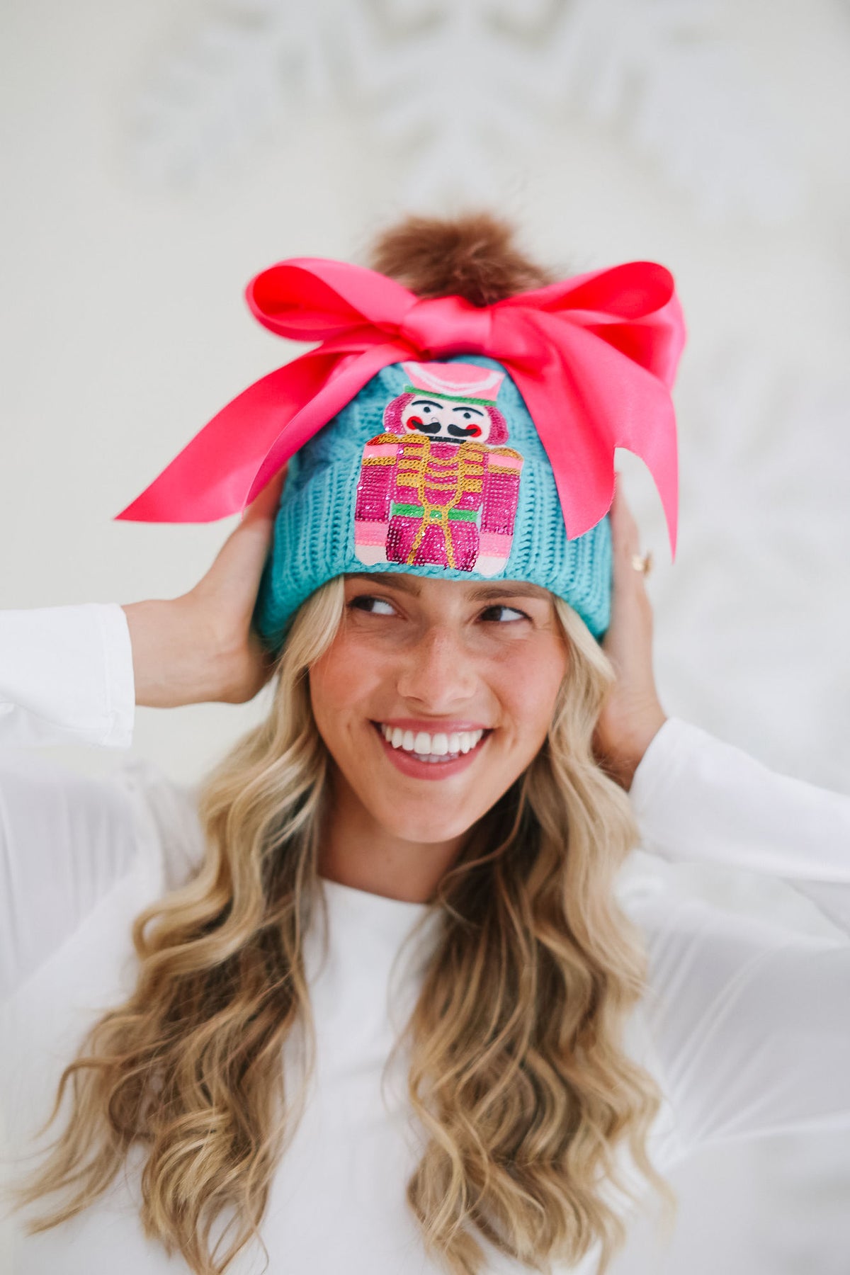 NUTCRACKER BOW TEAL BEANIE BEANIE Judith March
