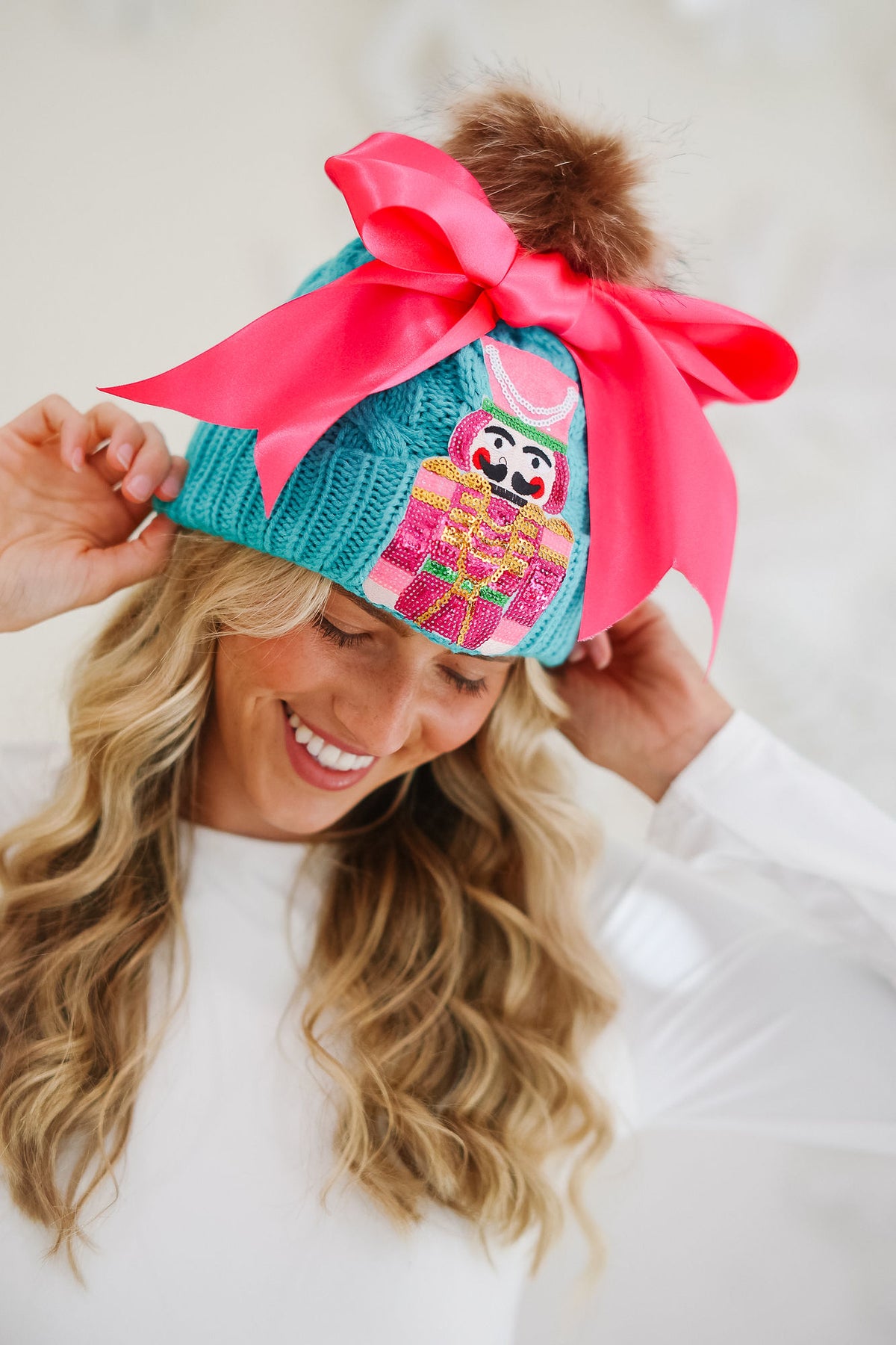 NUTCRACKER BOW TEAL BEANIE BEANIE Judith March