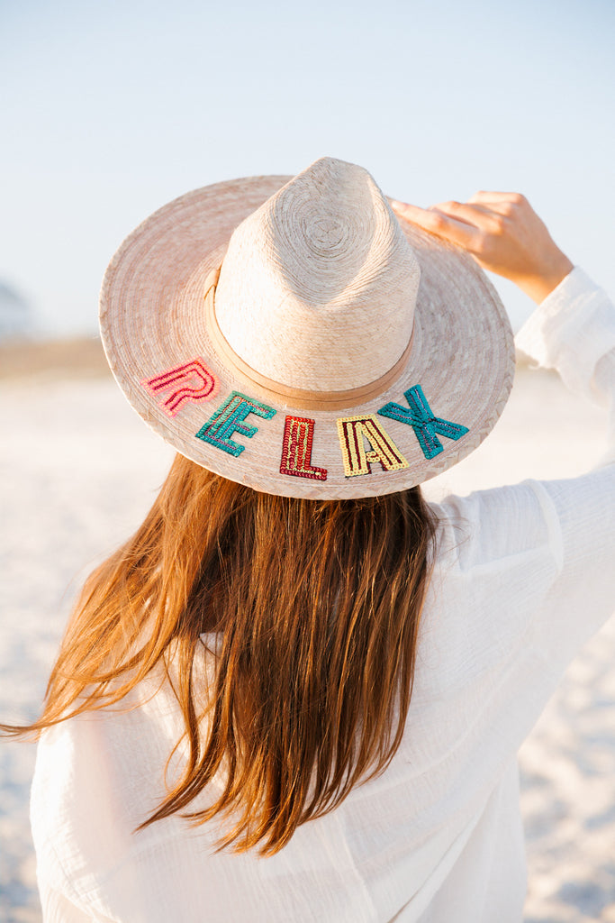Sun hat with Relax in rainbow sequin letters