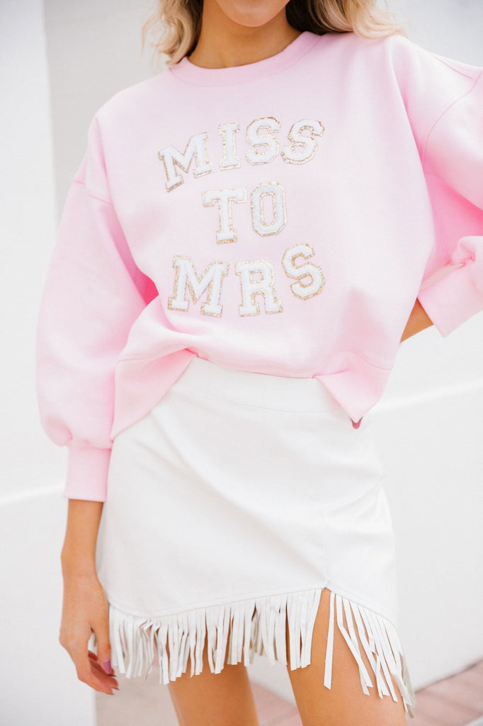 Pink cropped pullover with white "Miss To Mrs" letters
