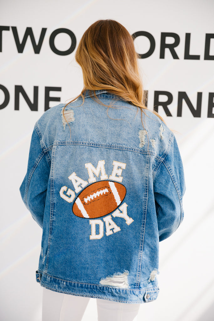 Denim distressed jacket with large football patch and Game Day in mini glam white