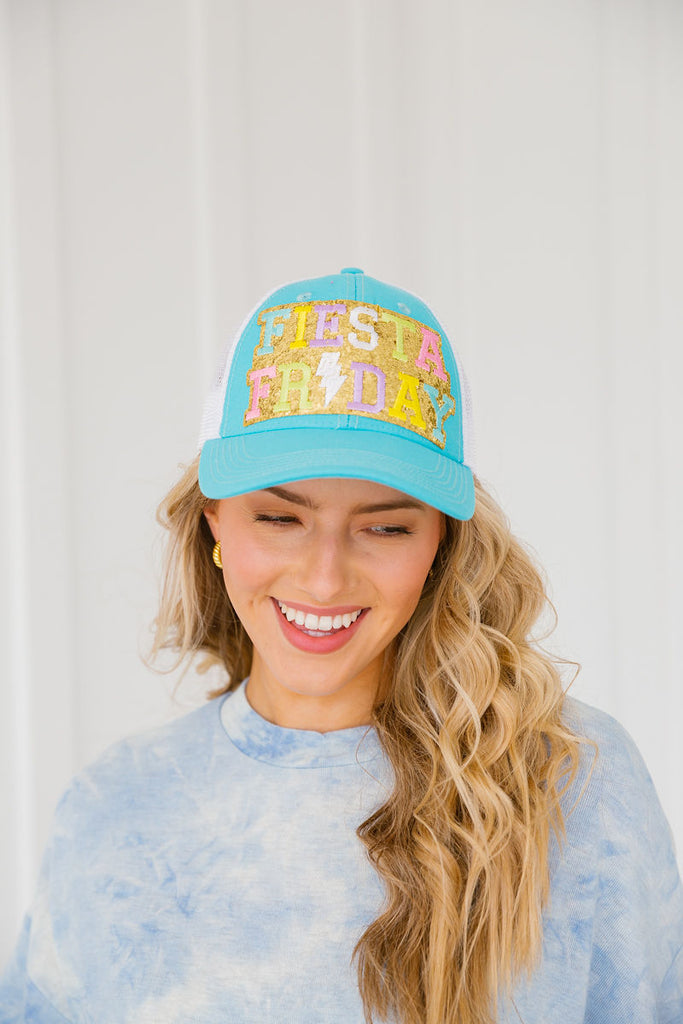 Turquoise baseball hat with Fiesta Friday patch