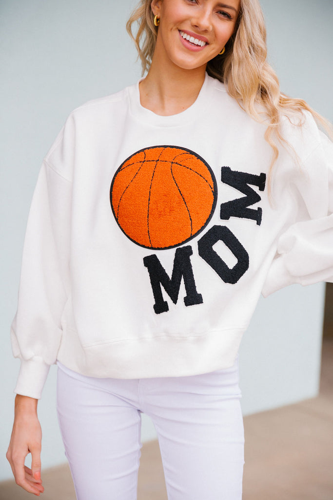 White cropped pullover with Mom in black varsity letters with a basketball patch