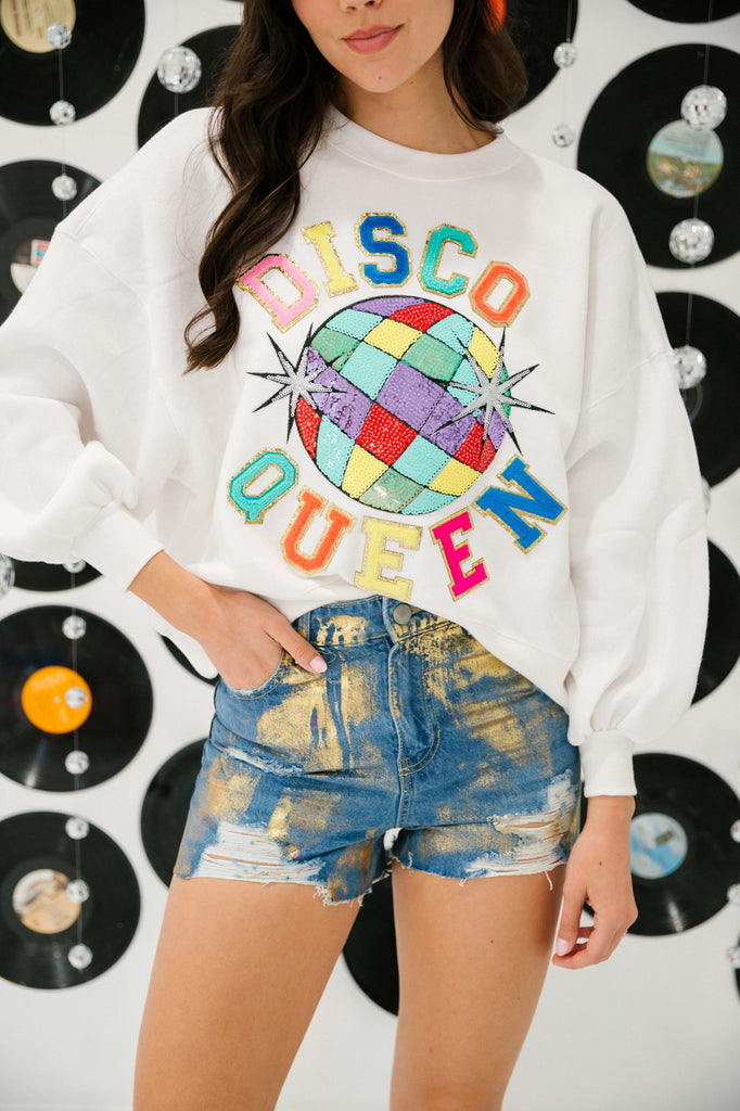 White cropped pullover with rainbow disco ball patch and Disco Queen in rainbow terry letters