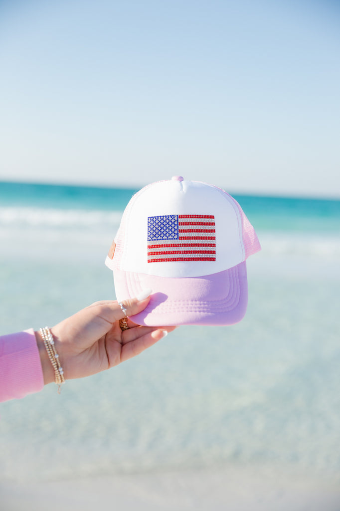 Kids pink and white trucker hat with an American flag patch