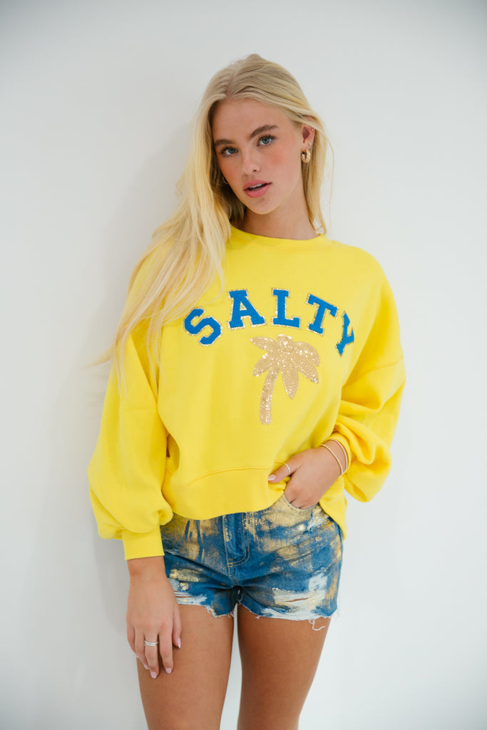 Yellow cropped pullover with Salty in royal blue letters and gold sequin palm tree patch 