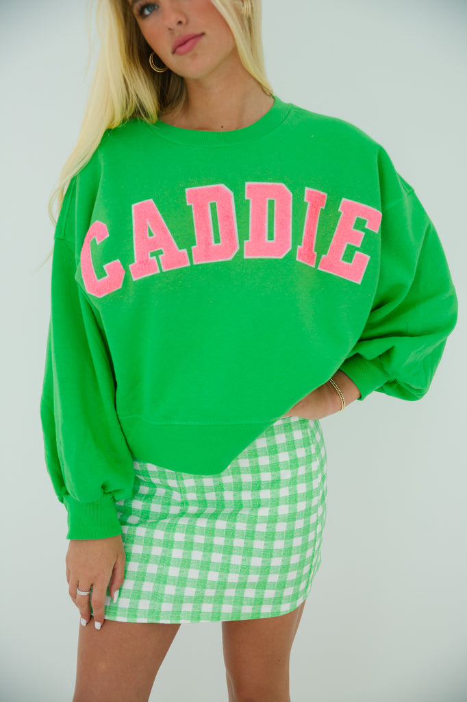 Green cropped pullover with Caddie in pink varsity letters
